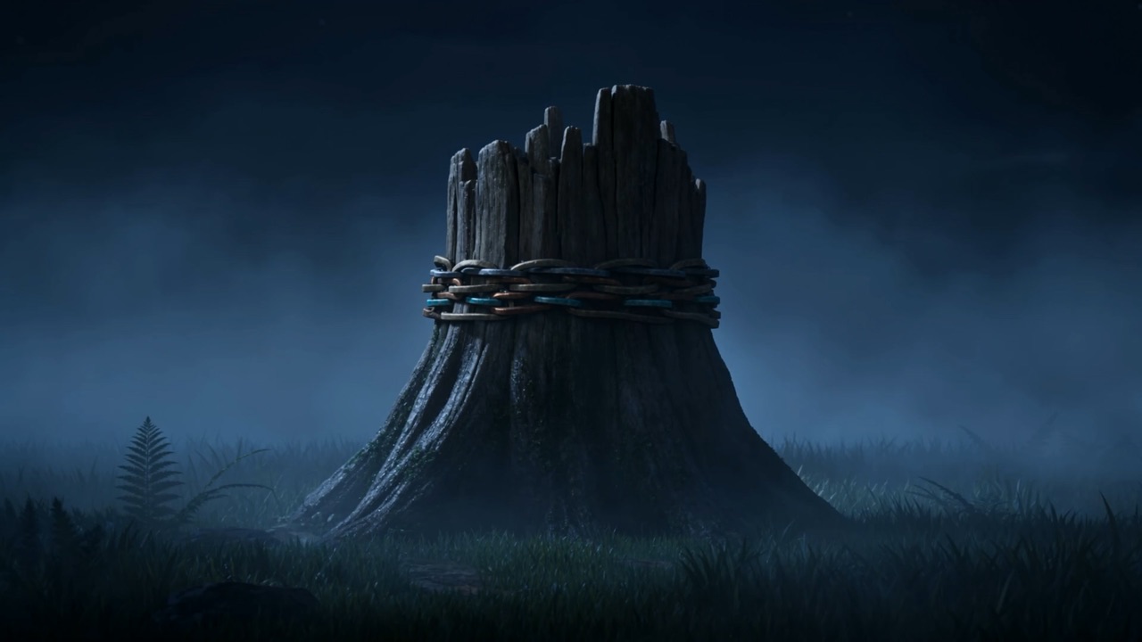 A dark stump stands alone in the misty field