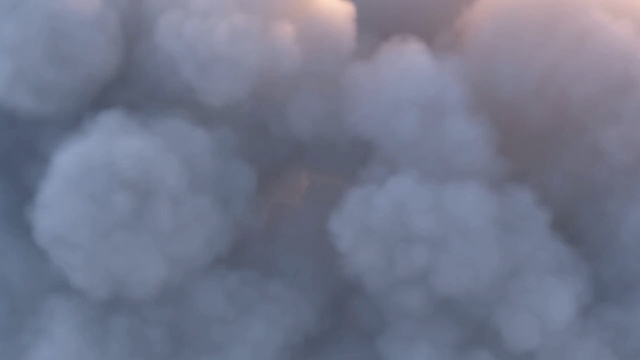 Through parted clouds — a village glowing at golden hour