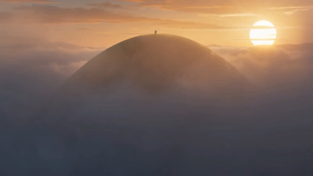 A lone figure on a green hilltop above the clouds at sunrise