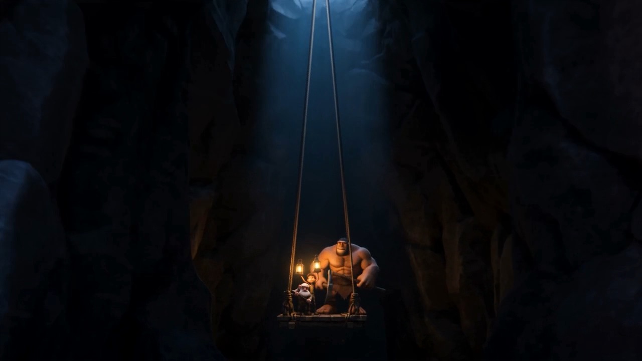 Men descending into the dark with lamps