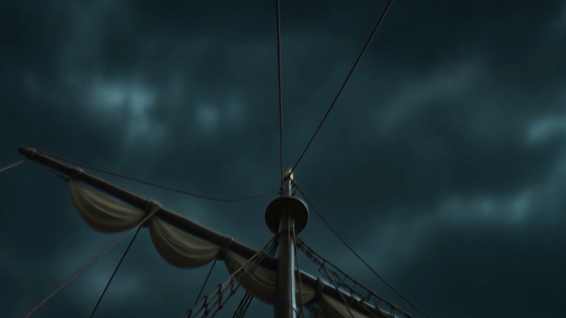 The mast black against the boiling sky