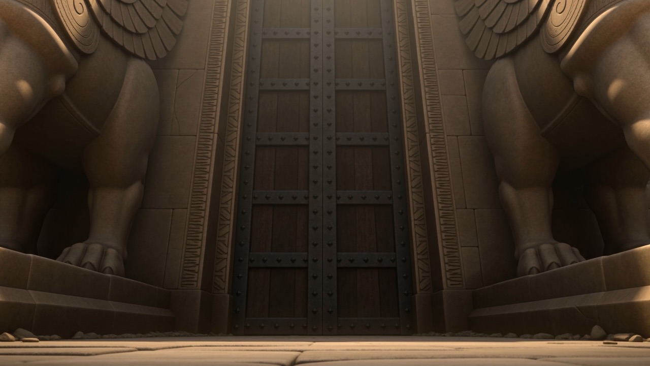 Behind him, the doors are enormous