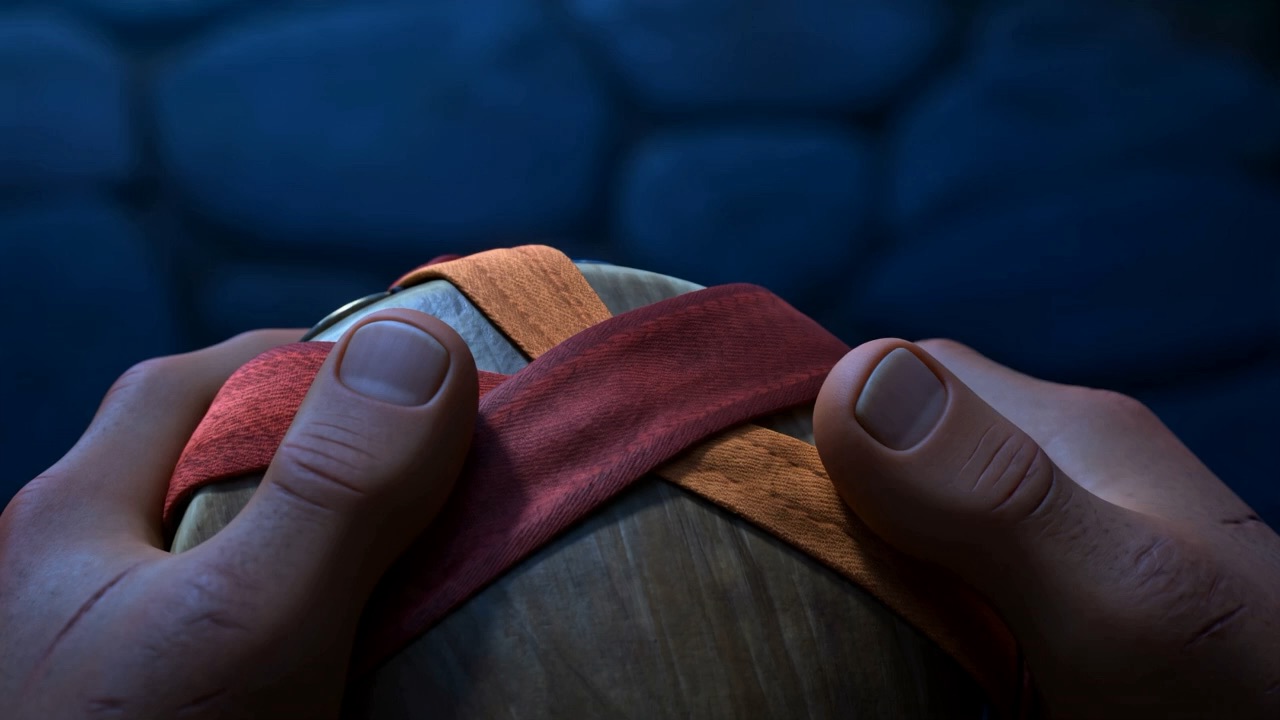 Both hands round a small drum