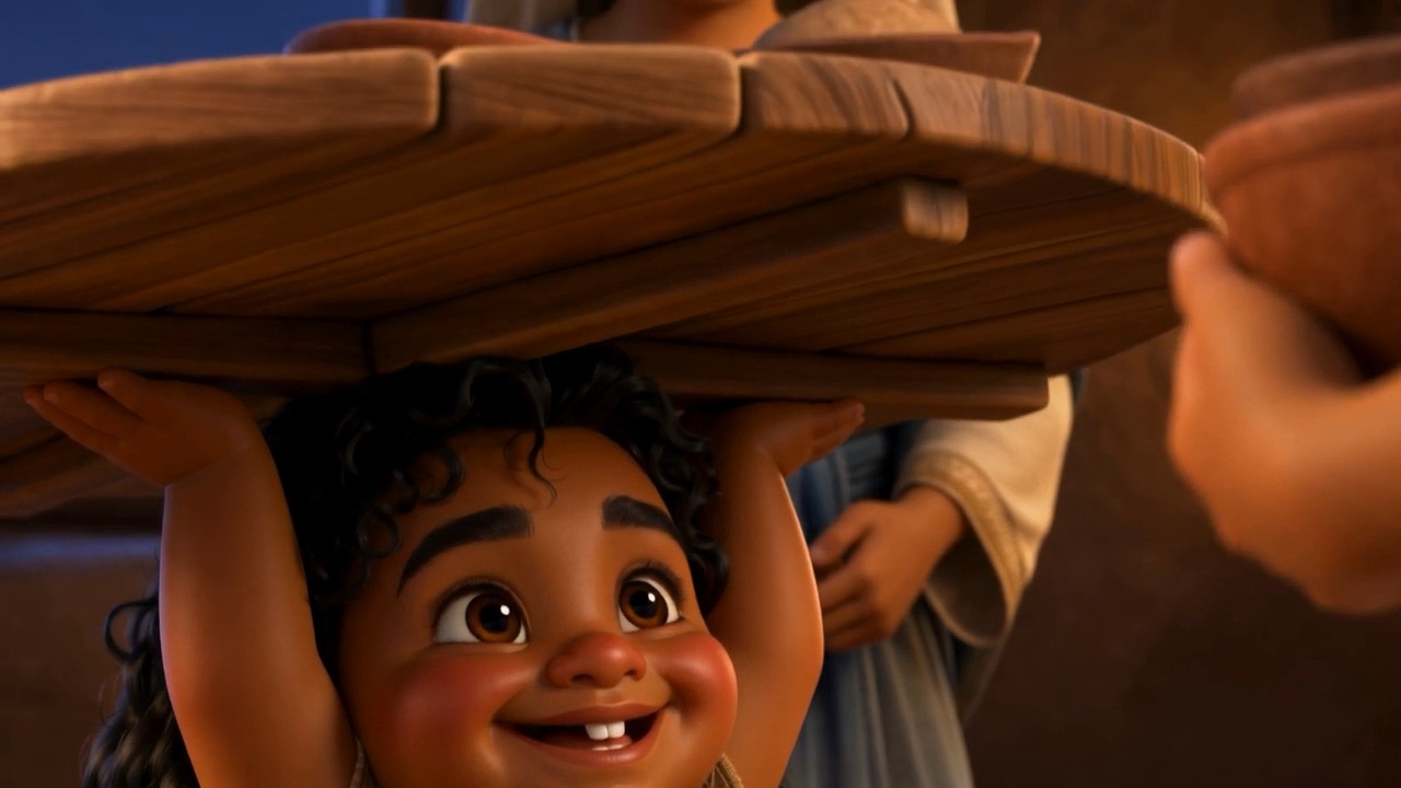 A gap-toothed grin from underneath the tabletop