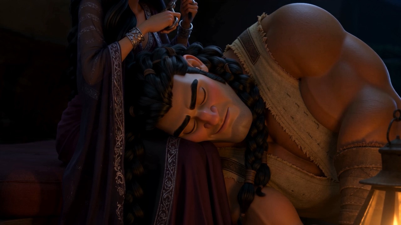 A man crouches at the doorway, taking each cut braid
