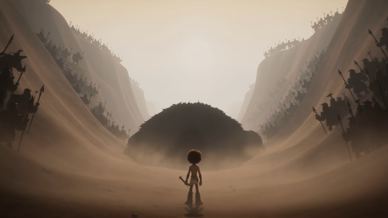 One small figure walks toward the giant in the dust