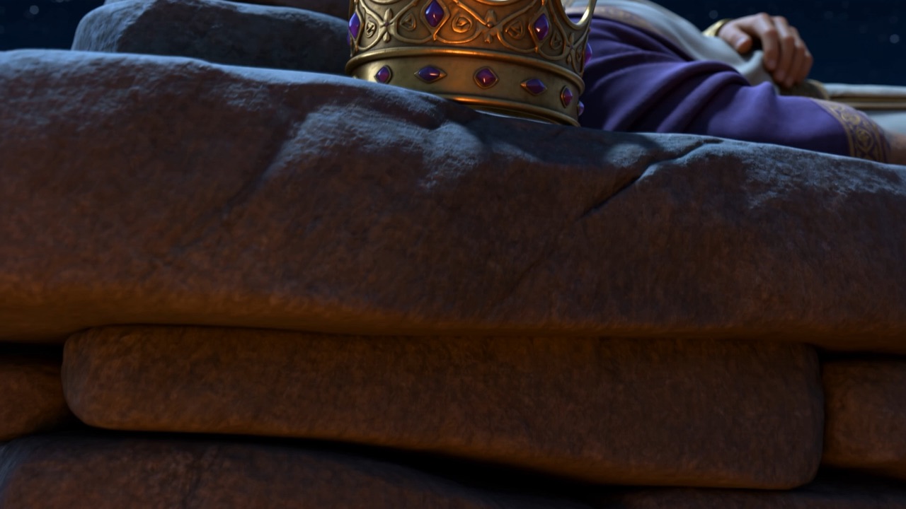 A crown set down on bare stone in the dark
