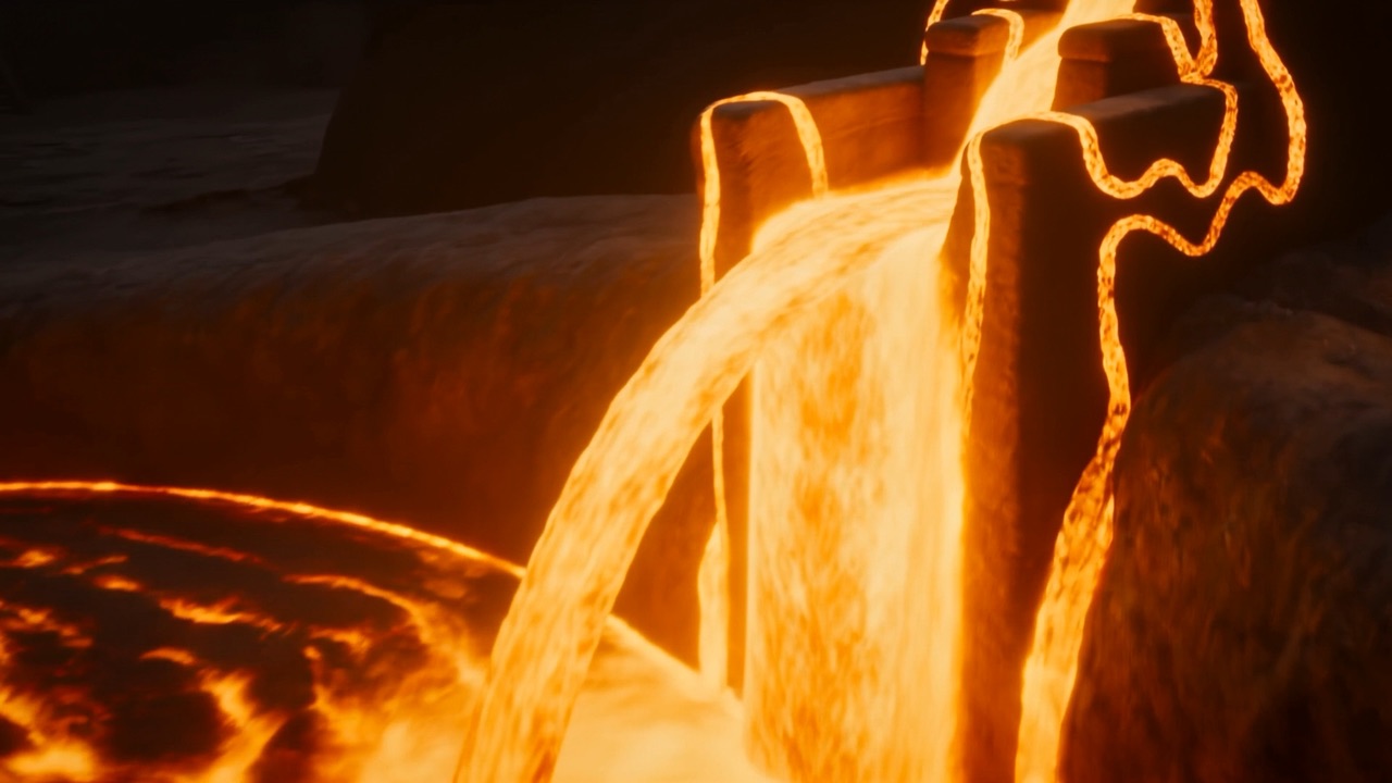 The crucible tips and bronze pours out in a blazing arc