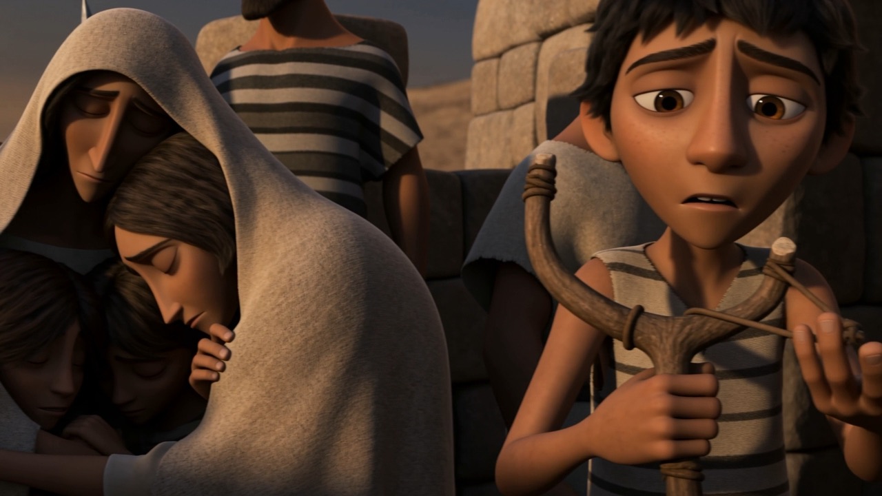 A boy holding a sling, far too young for this