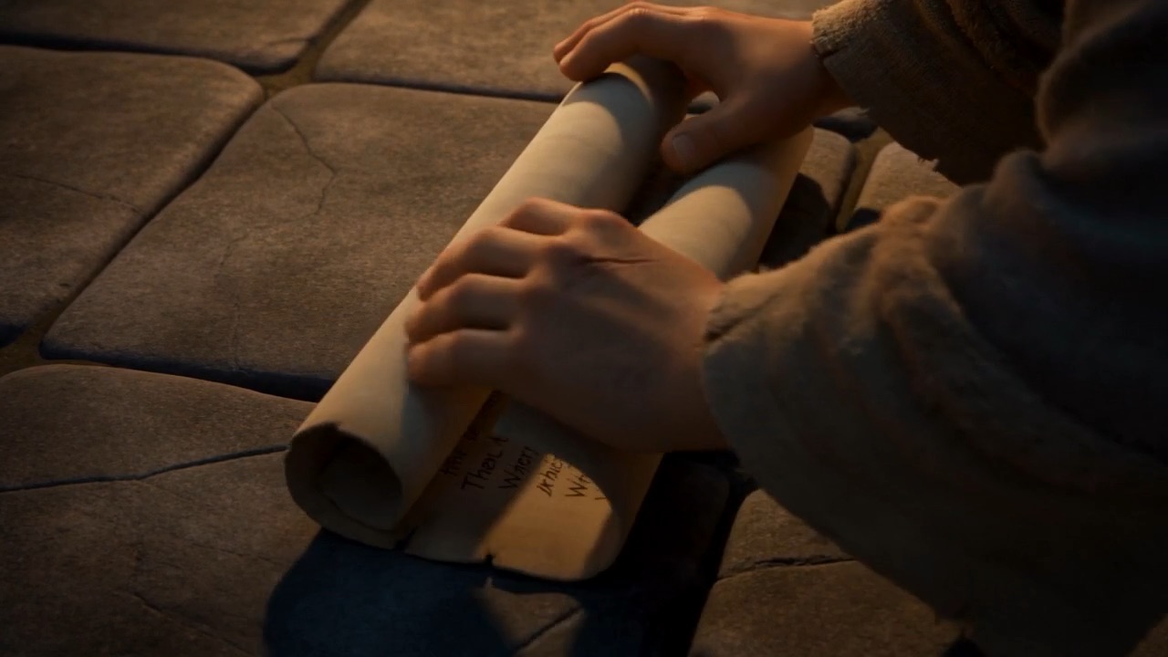 He unrolls the letter and flattens it out