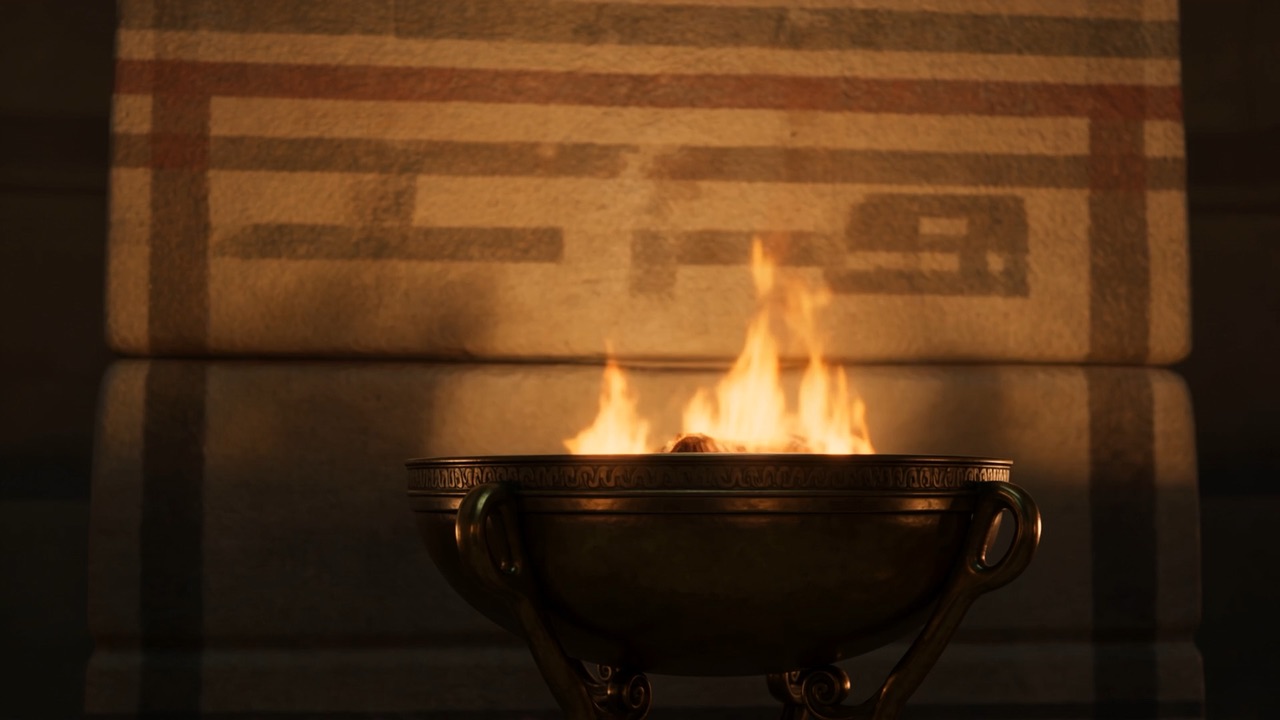A fire bowl burning in front of an inscription