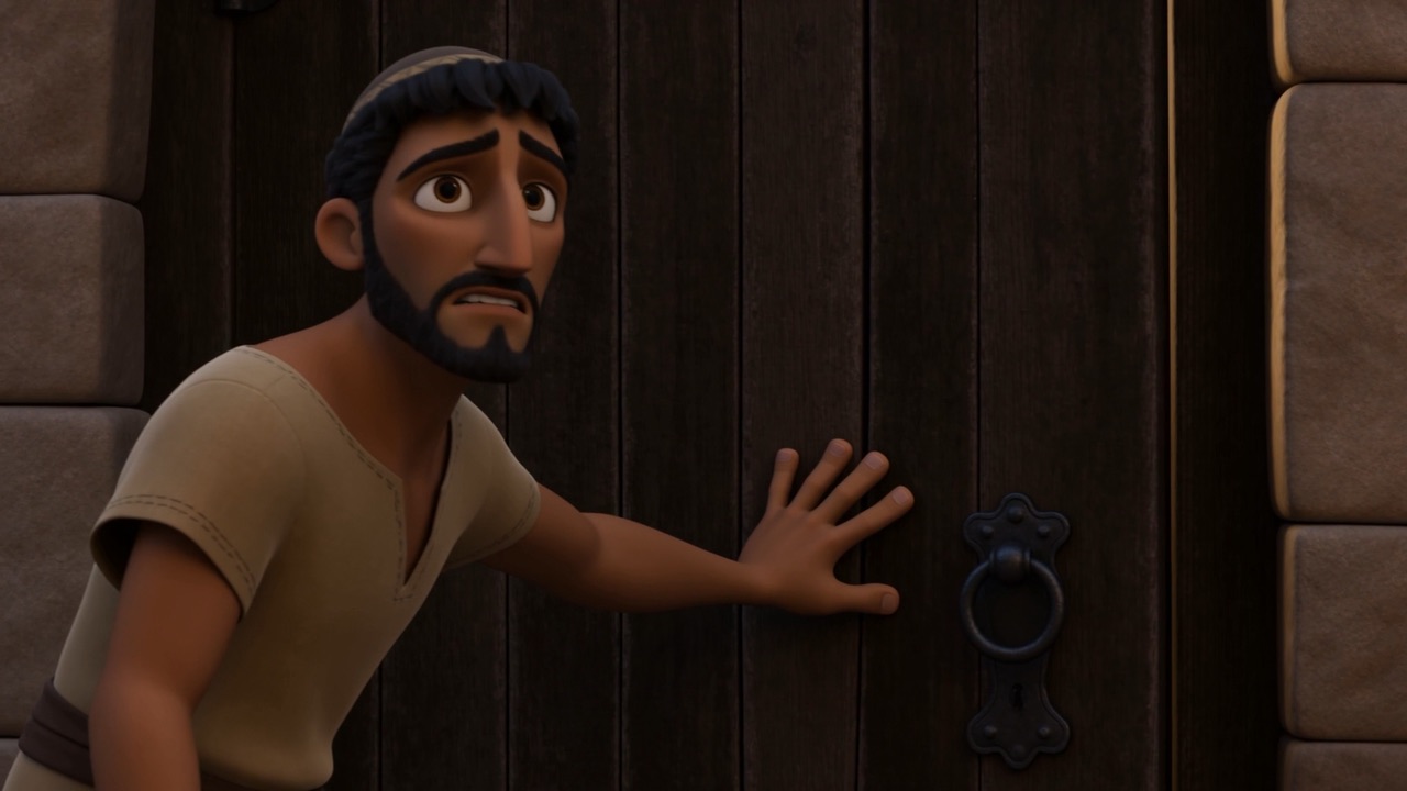 A hand pushing a door shut