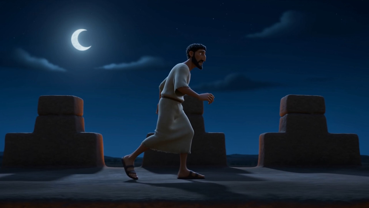A man walking the wall at night under a thin moon