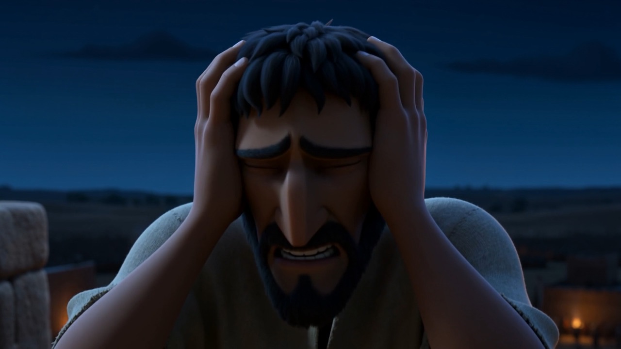He sits down and puts his head in his hands