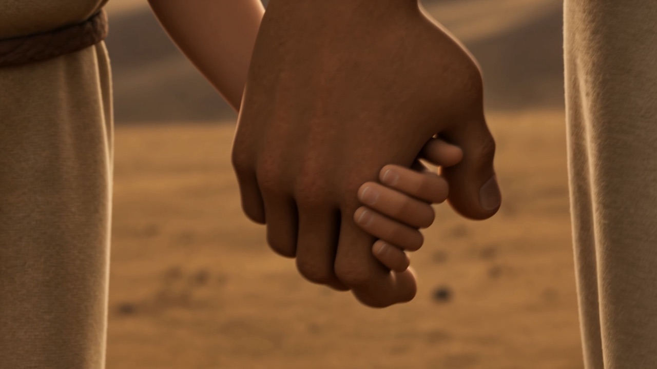 Two hands, an adult's and a child's, holding on