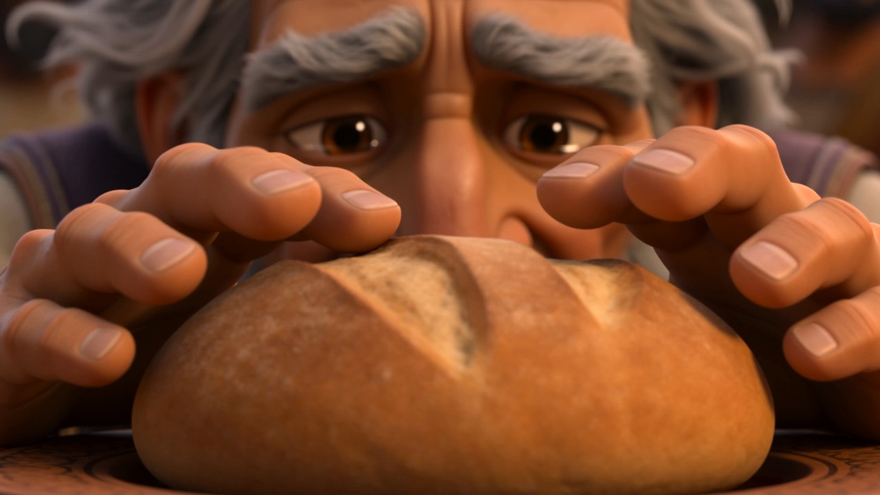 Both his hands close over the bread