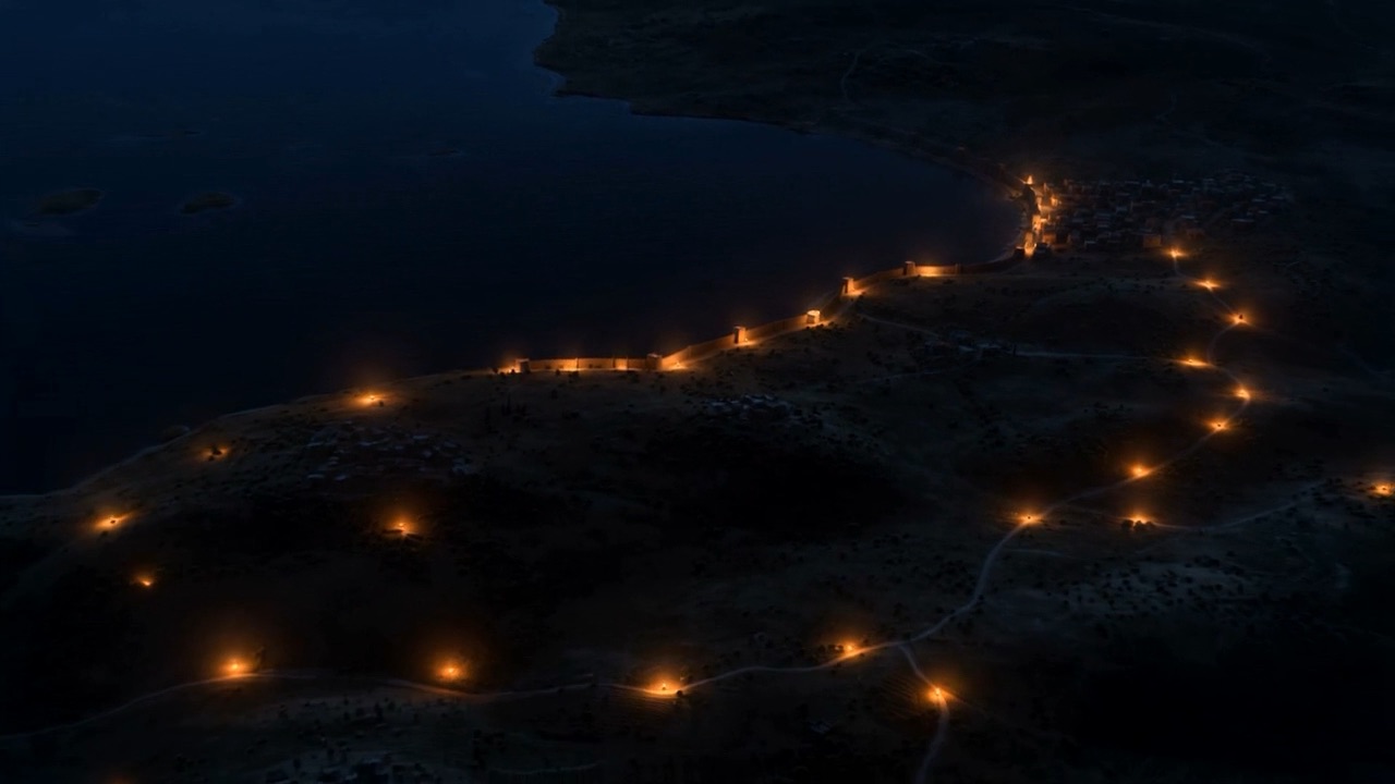 Lights strung out along the water