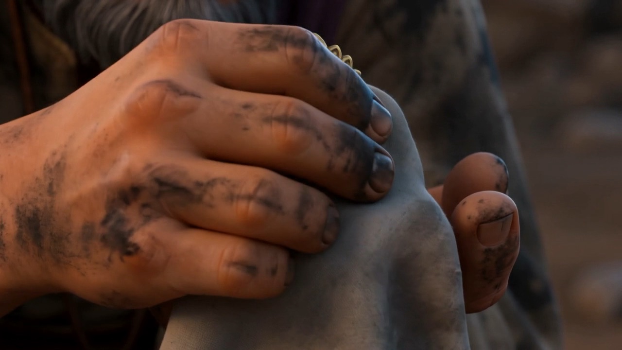He breathes on it, and polishes the soot off with his thumb