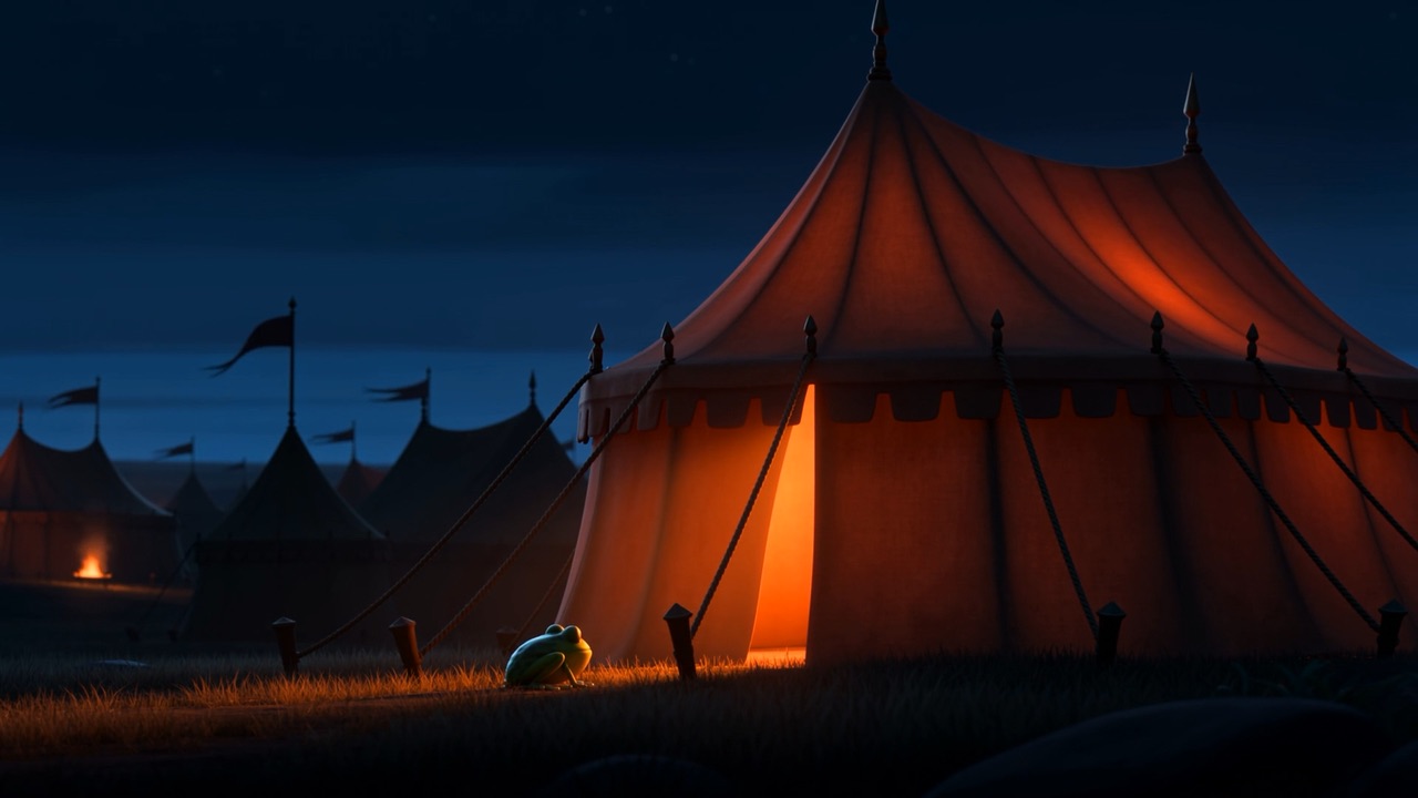 At the foot of the lit flap, in the grass, something small and green is waiting