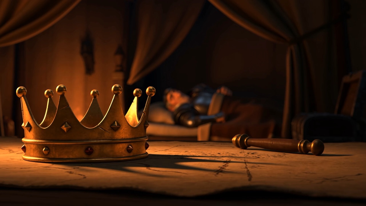 Inside: a dented gold crown standing on an unrolled map, and a hard face asleep beyond it