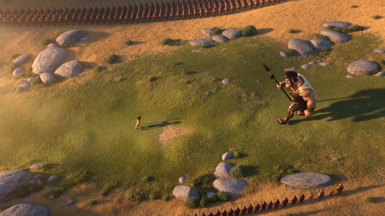 Far below the armies, a boy walks out to meet him