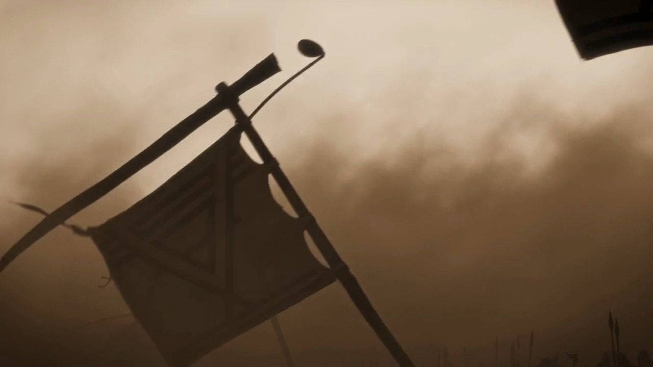 A banner tilts and falls against the dust