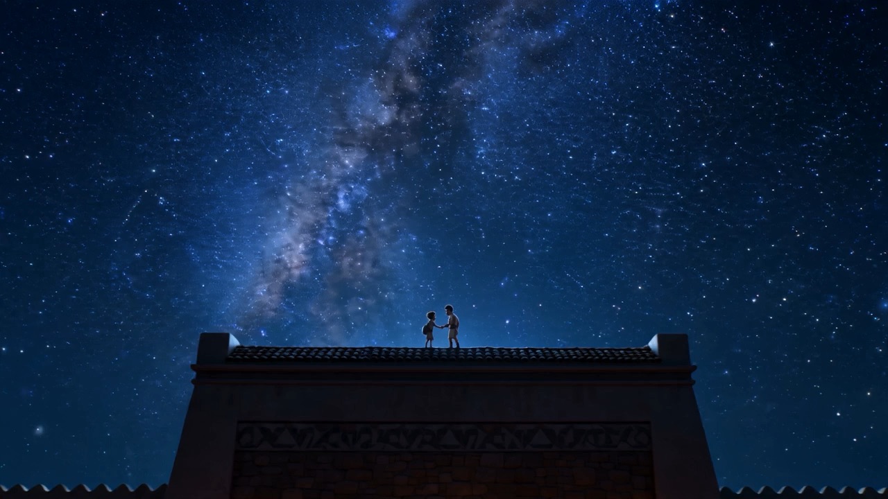 Two people on a roof under the whole sky